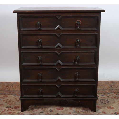 38 - A JACOBEAN DESIGN OAK CHEST of rectangular outline the shaped top above five long drawers on bracket... 