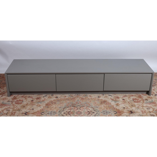 426 - A THREE PIECE CALLIGARIS SUITE comprising a pair of grey coffee tables with glazed tops each of rect... 