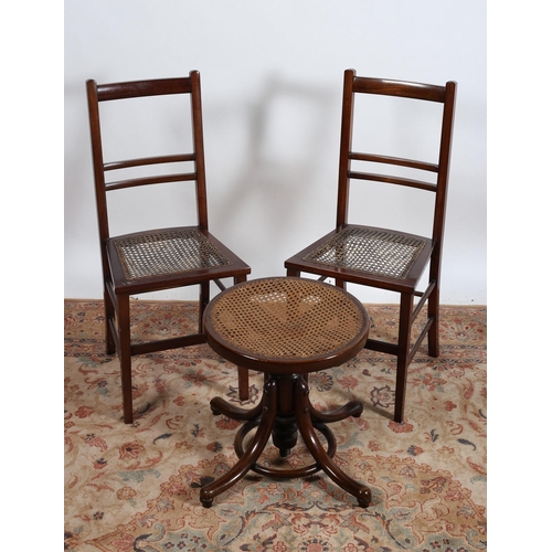 51 - A PAIR OF VINTAGE MAHOGANY AND CANE BEDROOM CHAIRS together with a bentwood revolving stool with can... 