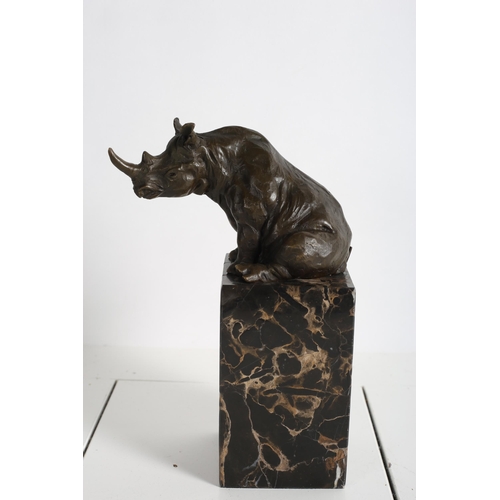 728 - after TOPERKIN 
A BRONZE FIGURE modelled as a rhinocerous shown seated on a veined marble pedestal
2... 