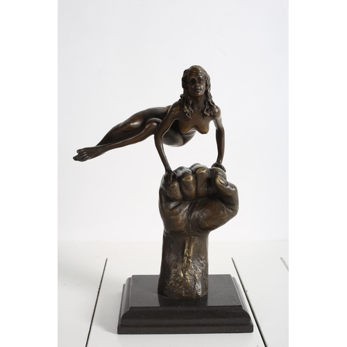 729 - after JUNO
A BRONZE FIGURE MODELLED AS A FEMALE shown balancing on a clenched fist raised on a black... 