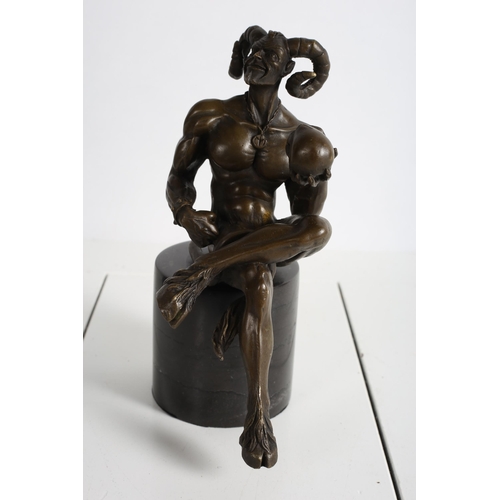 730 - after NICK 
A BRONZE FIGURE modelled as hellboy demon shown seated on a black marble pedestal 
24cm ... 