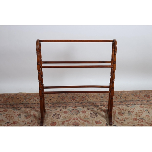 226 - A VINTAGE MAHOGANY FIVE BAR TOWEL RAIL on platform base with splayed legs 
90cm (h) x 77cm (w)