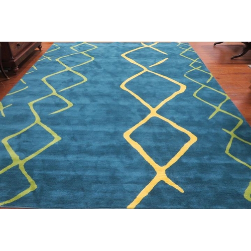 229 - A WOOL RUG the dark green ground with light green interwoven decoration 
420cm (l) x 298cm (w)