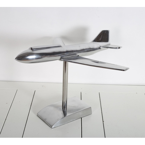 810 - A WHITE METAL FIGURE modelled as an Airbus raised on a cylindrical column and shaped platform base
3... 