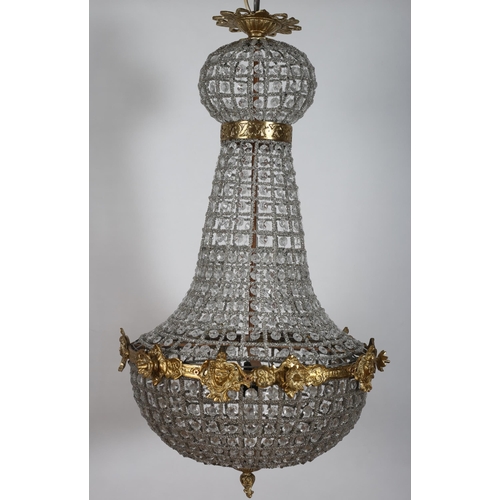 181 - A CONTINENTAL GILT BRASS AND CUT GLASS CHANDELIER with figural and foliate cast circlet inset overal... 