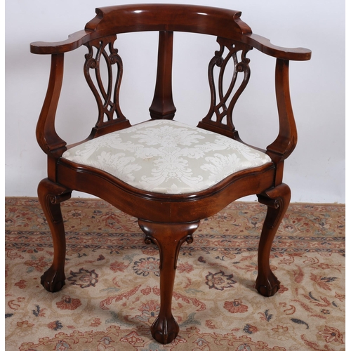 A CHIPPENDALE DESIGN MAHOGANY CORNER CHAIR the curved top rail with ...