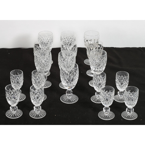 241 - A SET OF EIGHT WATERFORD CUT GLASS SHERRY GLASSES together with a set of eight Waterford cut glass p... 