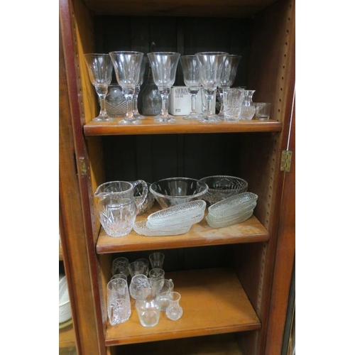 244 - A COLLECTION OF GLASSWARE to include a cut glass jug, cut glass bowls, a set of eight wine glasses, ... 