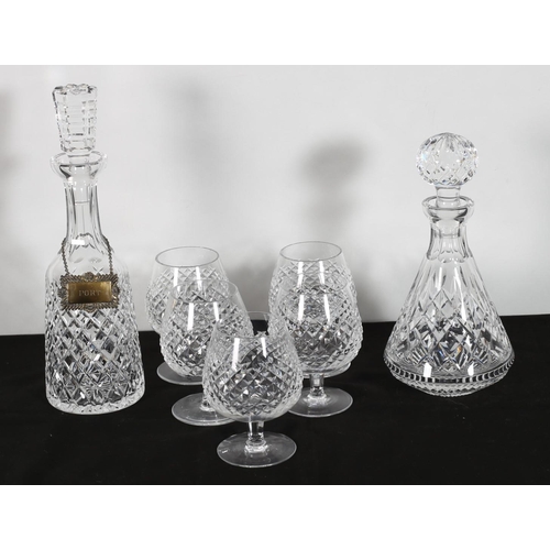 65 - TWO WATERFORD CUT GLASS DECANTERS WITH STOPPERS together with five Waterford cut glass brandy glasse... 