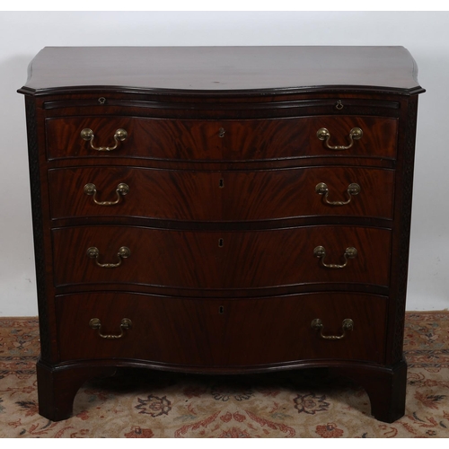 79 - A FINE GEORGIAN DESIGN MAHOGANY CHEST of serpentine outline the shaped top above a brush and slide a... 