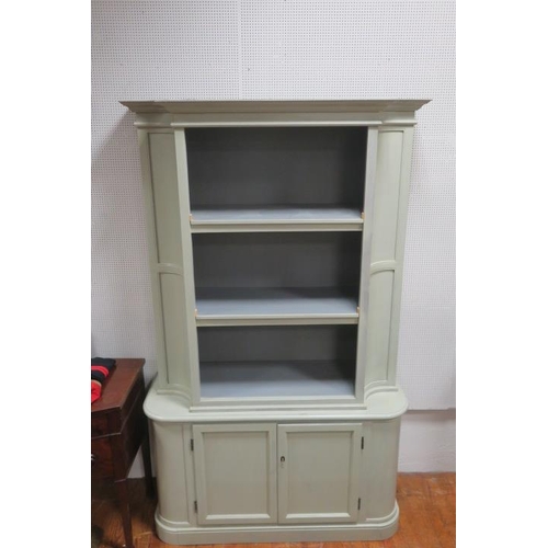 82 - A GREY PAINTED OPEN FRONT CABINET the moulded cornice above three open shelves flanked by cavetto pa... 