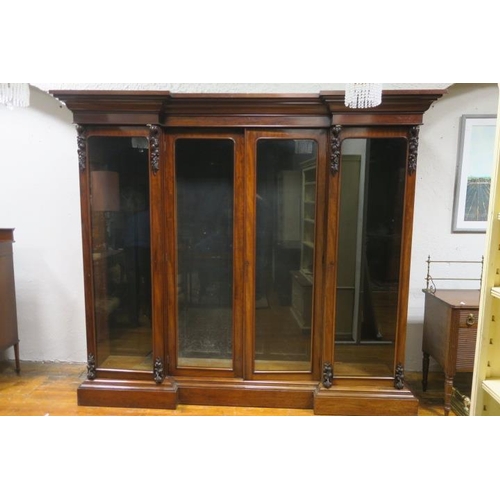 83 - A 19TH CENTURY MAHOGANY LIBRARY BOOKCASE of inverted breakfront outline the moulded cornice above fo... 