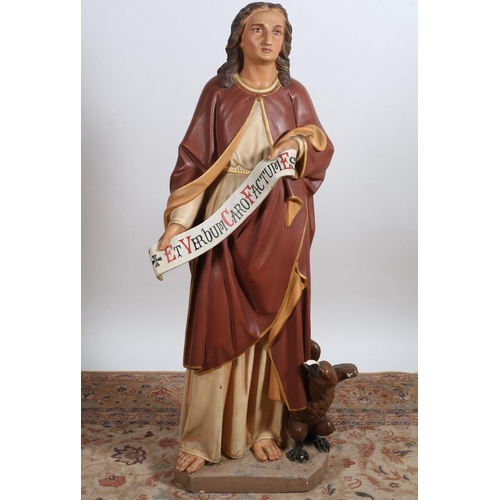 535 - A PLASTER AND CHROME PAINTED STATUE of a female saint shown standing with an eagle by her side on a ... 