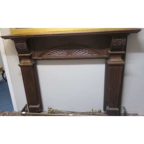 757 - A VINTAGE CARVED MAHOGANY CHIMNEY PIECE the rectangular shelf above a demi lune carved frieze betwee... 