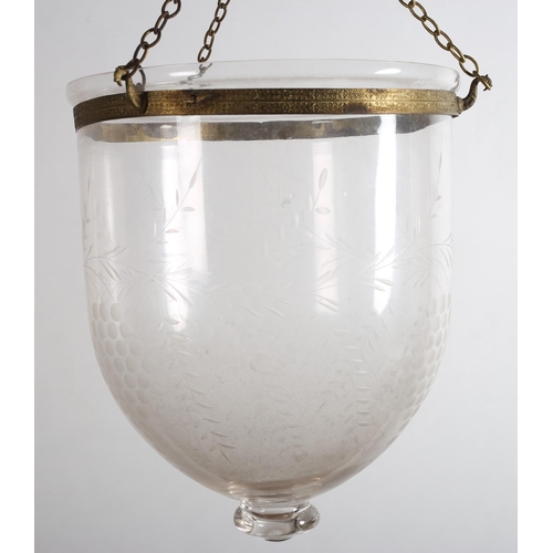 174 - AN ENGRAVED GLASS DISH LIGHT of cylindrical tapering form with brass circlet 
35cm drop