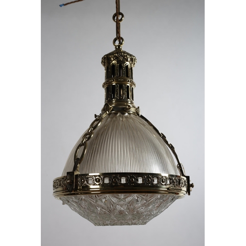 175 - A GILT BRASS AND CUT GLASS CENTRE LIGHT with pierced brass corona above a reeded glazed shade with p... 