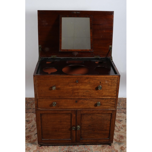 40 - A GEORGIAN MAHOGANY WASHSTAND the rectangular hinged top with fitted compartments and dressing mirro... 