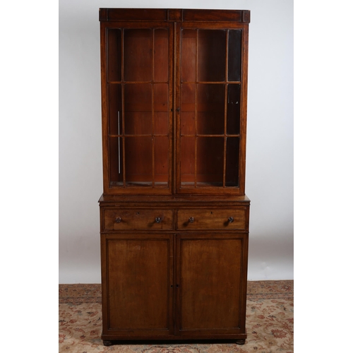 43 - A GEORGIAN MAHOGANY LIBRARY BOOKCASE the moulded cornice above a pair of astragal glazed doors conta... 