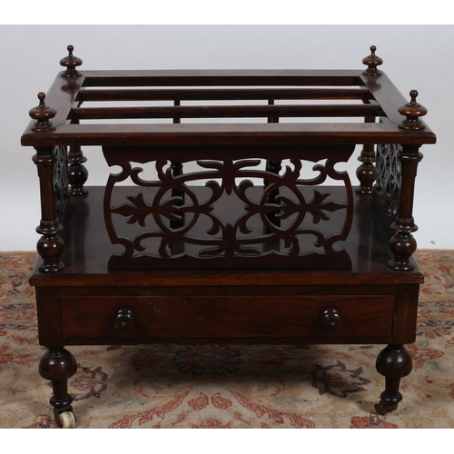 540 - A 19TH CENTURY ROSEWOOD THREE COMPARTMENT CANTERBURY of rectangular outline with pierced carved frie... 