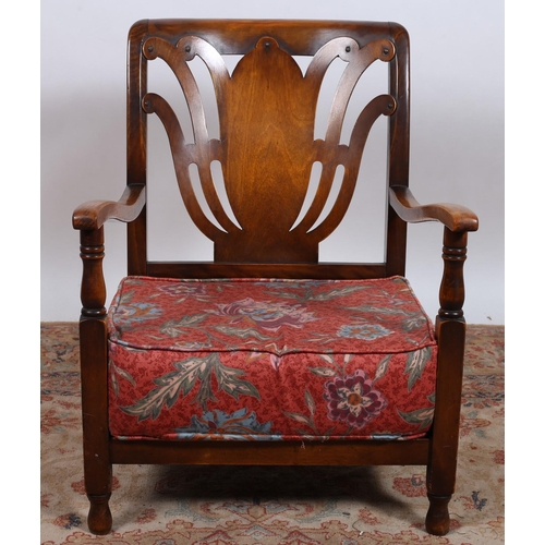 541 - A VINTAGE STAINED BEECHWOOD MINIATURE ARMCHAIR the curved top rail with pierced scroll splat and loo... 