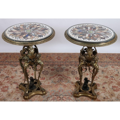 543 - A FINE AND IMPRESSIVE PAIR OF CONTINENTAL GILT BRASS AND BRONZE SPECIMEN MARBLE TABLES each of circu... 