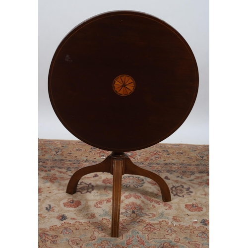 547 - A SHERATON DESIGN MAHOGANY AND SATINWOOD INLAID SNAP TOP WINE TABLE of circular outline the shaped t... 