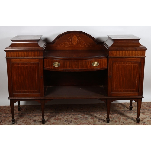 551 - A 19TH CENTURY HEPPLEWHITE DESIGN MAHOGANY SIDEBOARD of rectangular bowed outline with frieze drawer... 