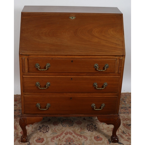 552 - A GEORGIAN DESIGN MAHOGANY BUREAU the rectangular top above a hinged writing slope containing pigeon... 