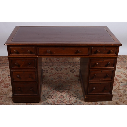 558 - A 19TH CENTURY MAHOGANY PEDESTAL DESK of rectangular outline the shaped top with tooled leather inse... 