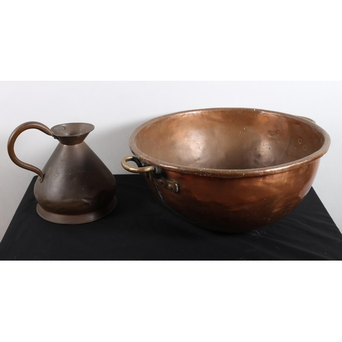 562 - A 19TH CENTURY COPPER PRESERVING PAN of domed form with brass carrying handles 
25cm (h) x 64cm (d) ... 