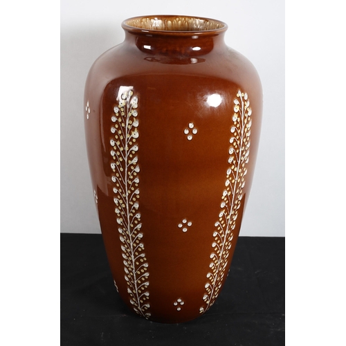 568 - A 20TH CENTURY AUSTRIAN GLAZED POTTERY VASE of baluster form the brown ground with stylised foliage ... 