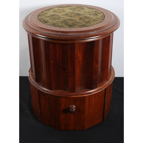 571 - A 19TH CENTURY MAHOGANY COMMODE of cylindrical outline the hinged lid above a concave frieze the bas... 