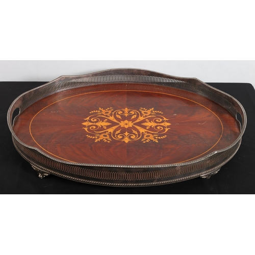 578 - A VINTAGE MAHOGANY INLAID TRAY of oval outline with pierced plated gallery with carrying handles on ... 