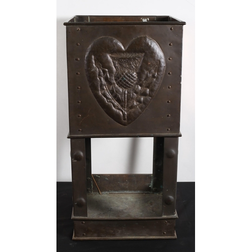 579 - AN ART NOUVEAU COPPER STICK STAND of square form the frieze embossed with symbols of Ireland, Englan... 