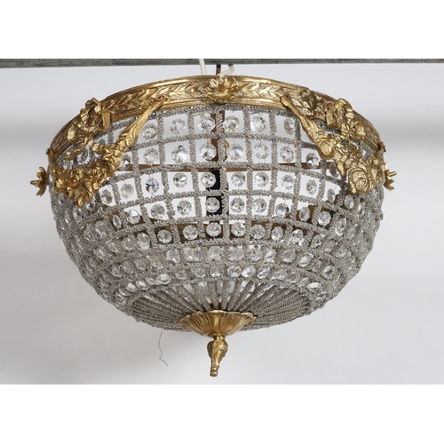 745 - A CONTINENTAL GILT BRASS AND CUT GLASS CENTRE LIGHT of dome outline the circlet hung with ribbon tie... 