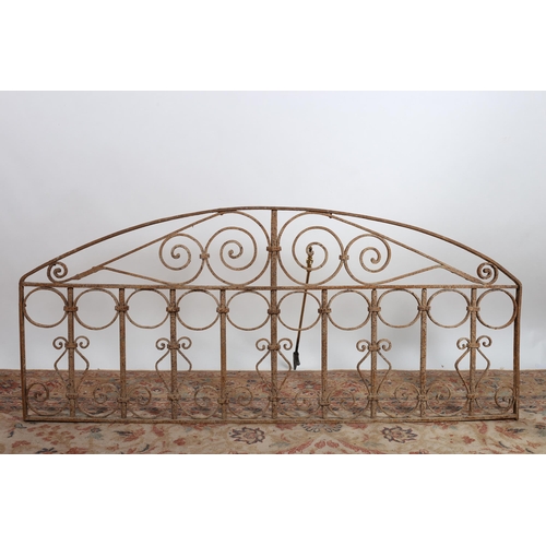 748 - A 19TH CENTURY WROUGHT IRON SCREEEN of rectangular bowed outline with C-scroll and cylindrical decor... 