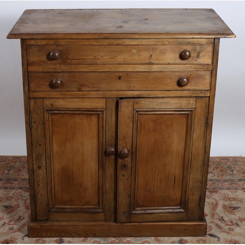 750 - A VINTAGE PINE CUPBOARD of rectangular outline with two frieze drawers above a pair of panelled door... 