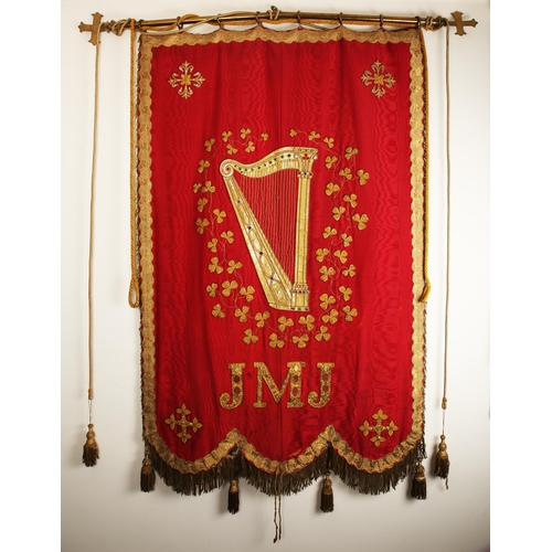 120 - A 19th century processional banner venerating the Holy Family. A cream watered silk banner, enclosed... 