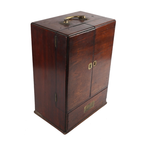 24 - Campaign apothecary chest. A George III mahogany chest, the top with brass carrying handle above twi... 