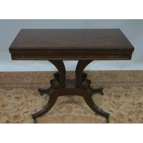 98 - A REGENCY MAHOGANY FOLDOVER SUPPER TABLE the rectangular hinged top raised on quadruped scrolle supp... 