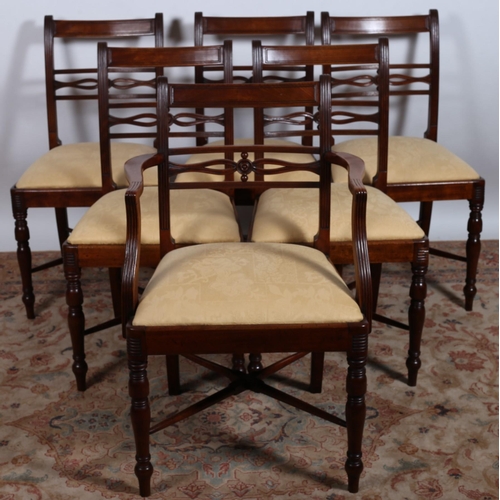 121 - A SET OF SIX REGENCY DESIGN MAHOGANY DINING CHAIRS  including an elbow chair each with a curved top ... 