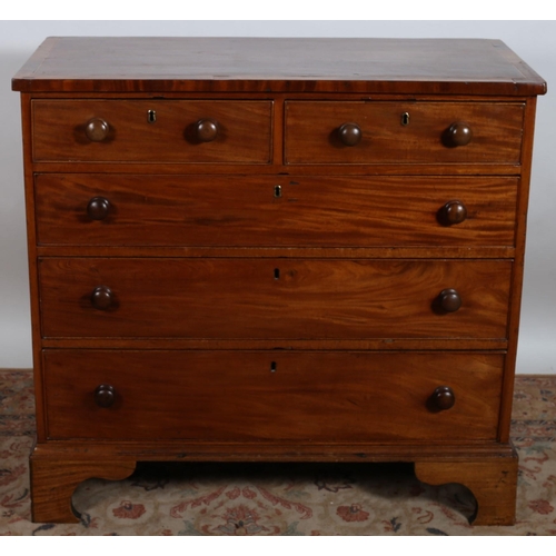 122 - A NINETEENTH CENTURY MAHOGANY CROSS BANDED CHEST of rectangular outline the shaped top above two sho... 