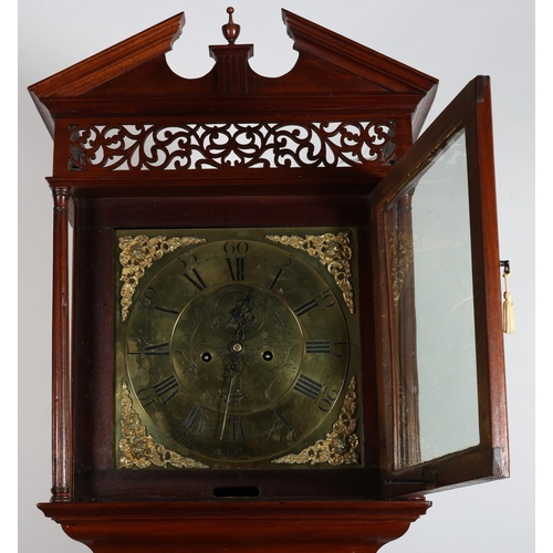 233 - A GEORGIAN MAHOGANY LONGCASE CLOCK the architectural pediment above a glazed door containing  a bras... 