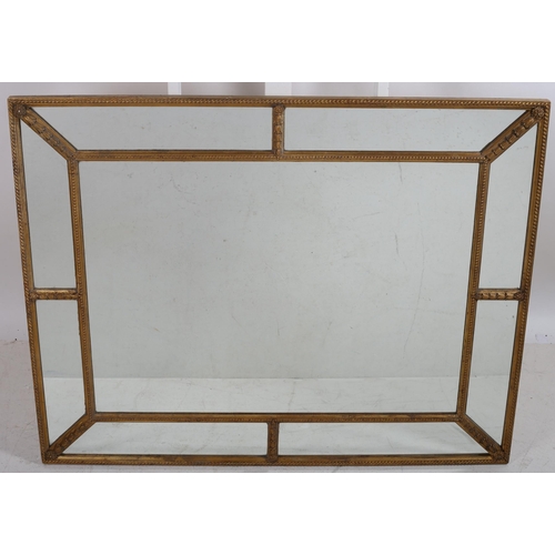 39 - A CONTINENTAL GILTWOOD AND GESSO COMPARTMENTED OVERMANTLE MIRROR the rectangular frame containing mi... 