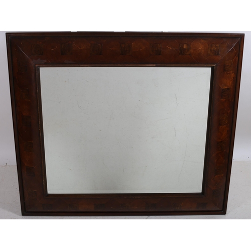 40 - AN OYSTERWOOD FRAMED MIRROR the rectangular bevelled glass plate within a cushion frame
123 cm (h) x... 