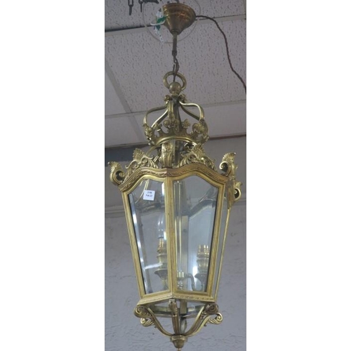 50 - A GOOD 19TH CENTURY GILT BRASS THREE LIGHT LANTERN of octagonal form with bevelled glass panels with... 