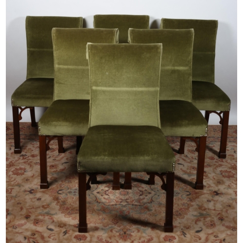 56 - A SET OF SIX CHIPPENDALE DESIGN MAHOGANY AND UPHOLSTERED DINING CHAIRS each with an upholstered scro... 