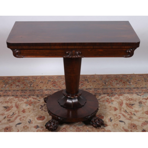61 - A 19TH CENTURY ROSEWOOD FOLDOVER SUPPER TABLE the rectangular hinged top  with carved frieze raised ... 