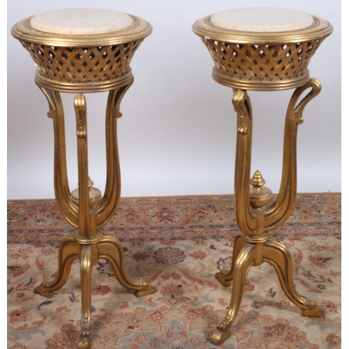 70 - A PAIR OF CONTINENTAL GILTWOOD AND MARBLE JARDINIERE STANDS each of circular outline surmounted by a... 